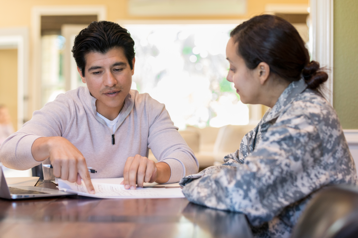 man explaining estate planning document to female lawyer